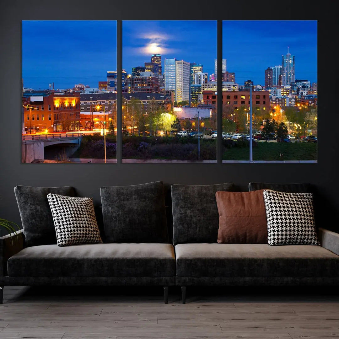 The Denver City Lights Night Blue Skyline Cityscape View Wall Art Canvas Print showcases a stunning night cityscape. Printed on museum-quality canvas with a UV-protective coating, this artwork comes ready to hang, adding an effortless touch of elegance.