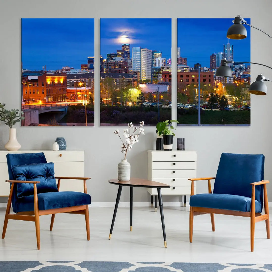 The Denver City Lights Night Blue Skyline Cityscape View Wall Art Canvas Print showcases a stunning night cityscape. Printed on museum-quality canvas with a UV-protective coating, this artwork comes ready to hang, adding an effortless touch of elegance.