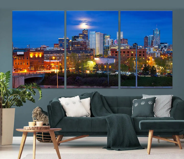 The Denver City Lights Night Blue Skyline Cityscape View Wall Art Canvas Print showcases a stunning night cityscape. Printed on museum-quality canvas with a UV-protective coating, this artwork comes ready to hang, adding an effortless touch of elegance.