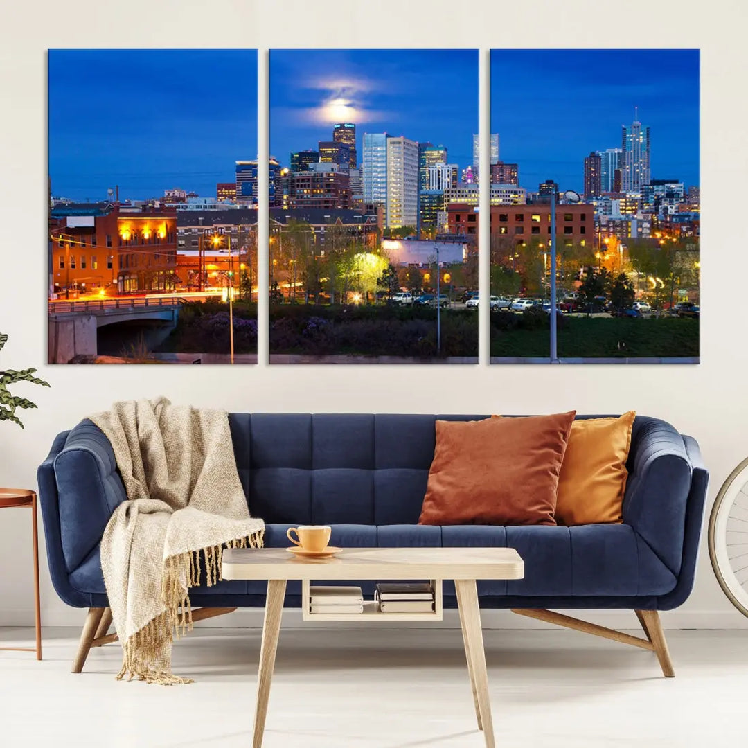 The Denver City Lights Night Blue Skyline Cityscape View Wall Art Canvas Print showcases a stunning night cityscape. Printed on museum-quality canvas with a UV-protective coating, this artwork comes ready to hang, adding an effortless touch of elegance.