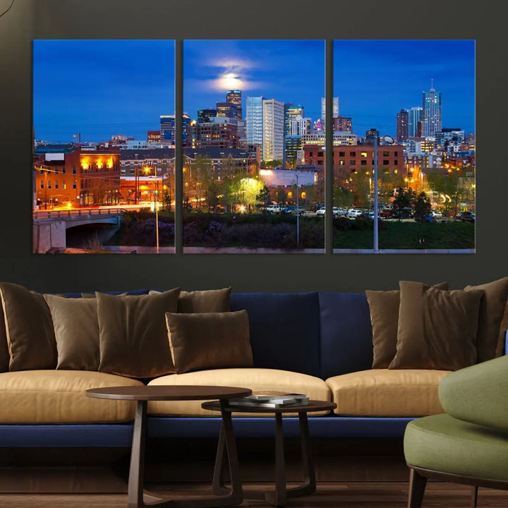 The Denver City Lights Night Blue Skyline Cityscape View Wall Art Canvas Print showcases a stunning night cityscape. Printed on museum-quality canvas with a UV-protective coating, this artwork comes ready to hang, adding an effortless touch of elegance.