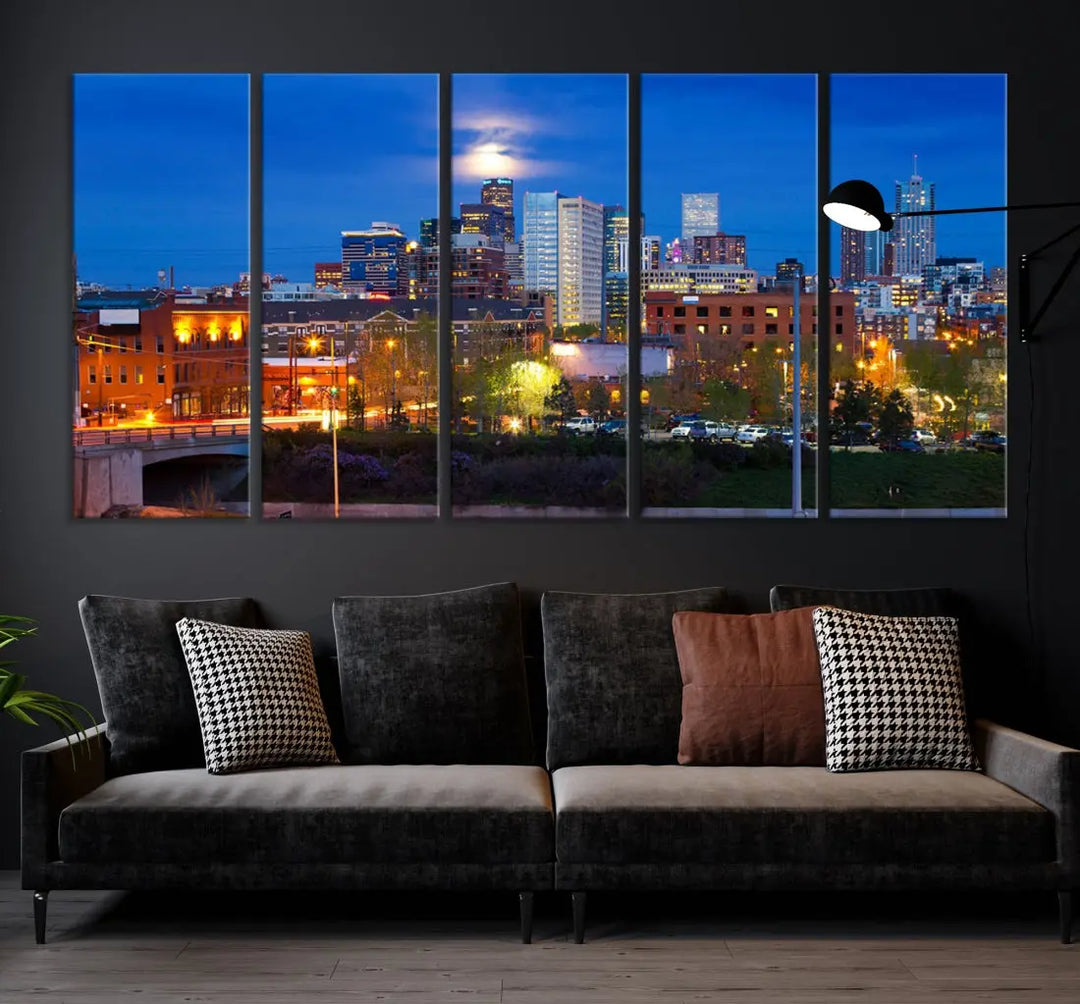 The Denver City Lights Night Blue Skyline Cityscape View Wall Art Canvas Print showcases a stunning night cityscape. Printed on museum-quality canvas with a UV-protective coating, this artwork comes ready to hang, adding an effortless touch of elegance.