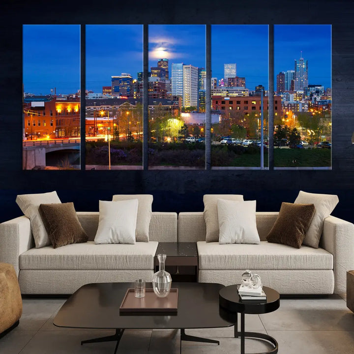 The Denver City Lights Night Blue Skyline Cityscape View Wall Art Canvas Print showcases a stunning night cityscape. Printed on museum-quality canvas with a UV-protective coating, this artwork comes ready to hang, adding an effortless touch of elegance.