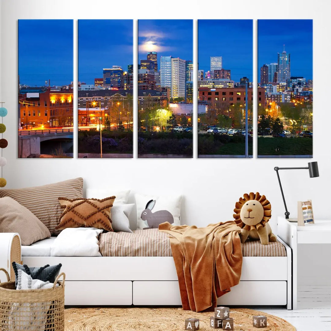 The Denver City Lights Night Blue Skyline Cityscape View Wall Art Canvas Print showcases a stunning night cityscape. Printed on museum-quality canvas with a UV-protective coating, this artwork comes ready to hang, adding an effortless touch of elegance.