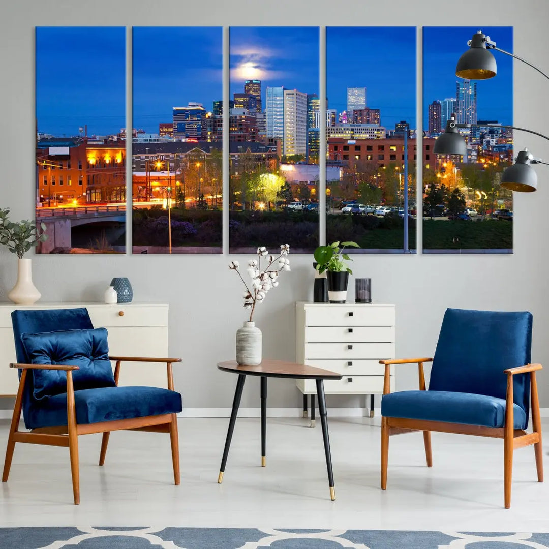 The Denver City Lights Night Blue Skyline Cityscape View Wall Art Canvas Print showcases a stunning night cityscape. Printed on museum-quality canvas with a UV-protective coating, this artwork comes ready to hang, adding an effortless touch of elegance.