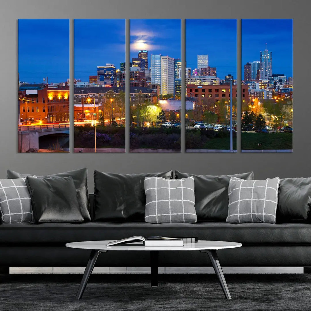 The Denver City Lights Night Blue Skyline Cityscape View Wall Art Canvas Print showcases a stunning night cityscape. Printed on museum-quality canvas with a UV-protective coating, this artwork comes ready to hang, adding an effortless touch of elegance.