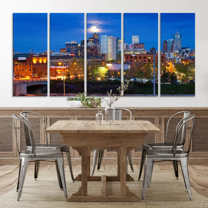 The Denver City Lights Night Blue Skyline Cityscape View Wall Art Canvas Print showcases a stunning night cityscape. Printed on museum-quality canvas with a UV-protective coating, this artwork comes ready to hang, adding an effortless touch of elegance.