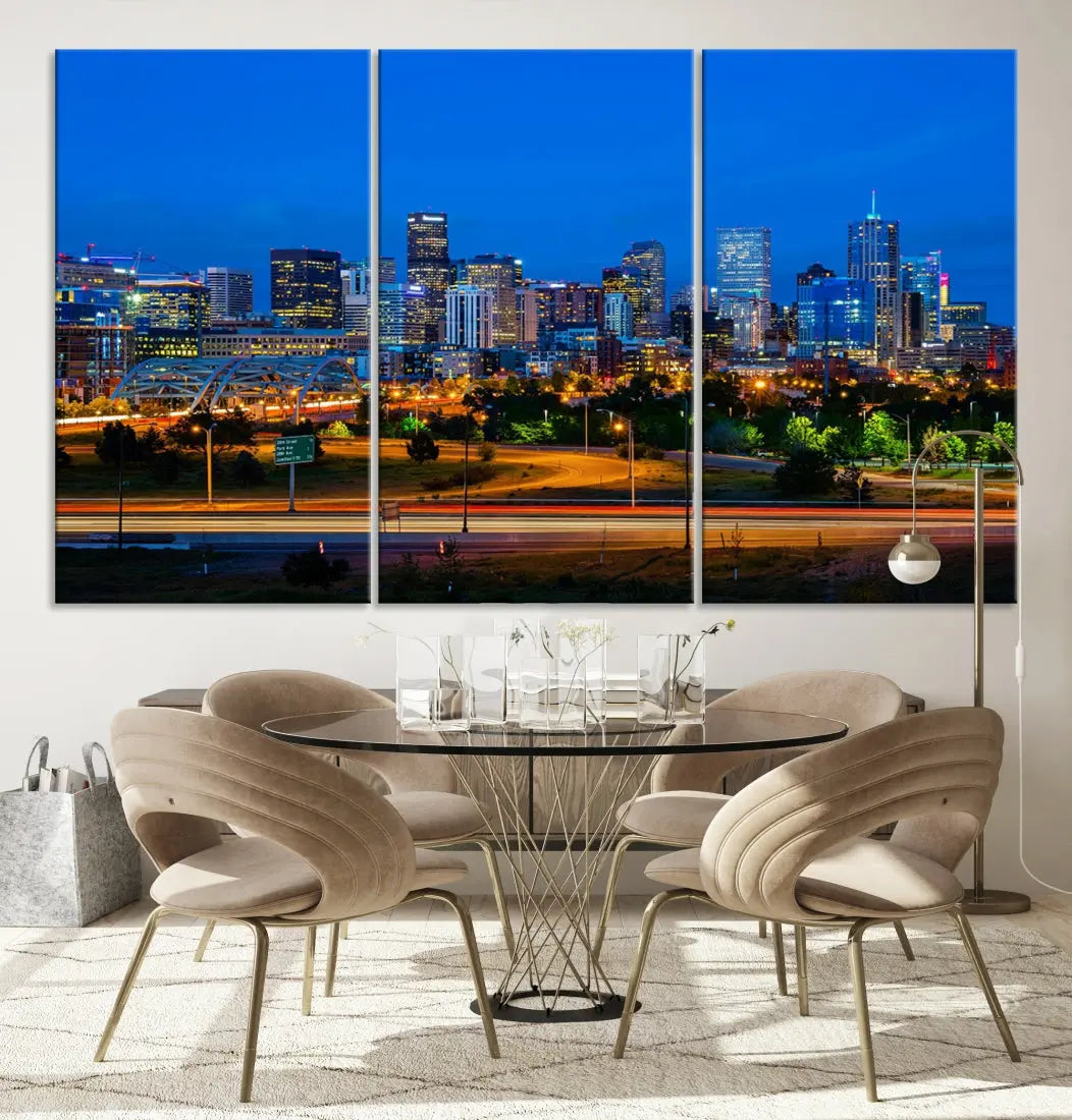 A modern living room showcases the "Denver City Lights Night Blue Skyline Cityscape View Wall Art Canvas Print" in a triptych arrangement. These museum-quality canvases, finished with a UV-protective coating, maintain their vibrant allure.