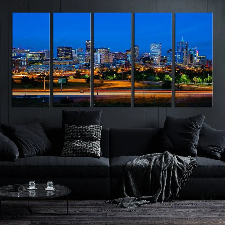 A modern living room showcases the "Denver City Lights Night Blue Skyline Cityscape View Wall Art Canvas Print" in a triptych arrangement. These museum-quality canvases, finished with a UV-protective coating, maintain their vibrant allure.