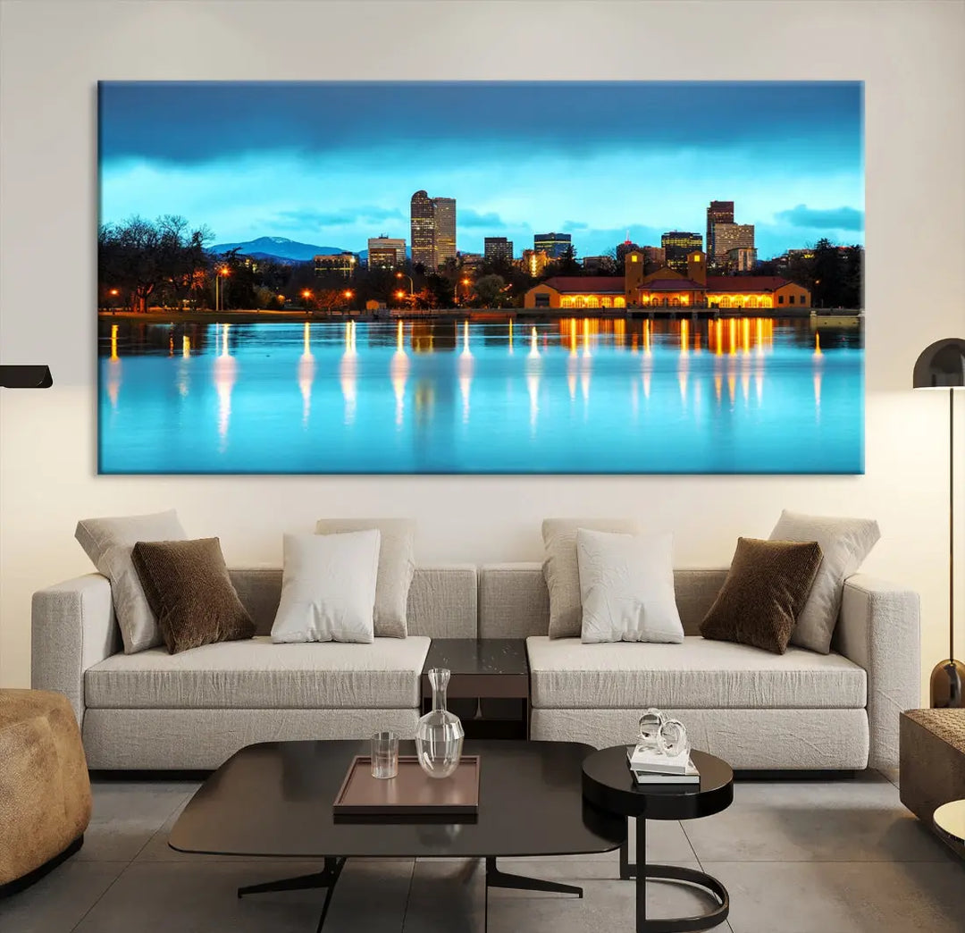 A living room in teal and brown decor showcases the "Denver City Lights Night Bright Turquoise Skyline Cityscape View" wall art canvas print above the couch. This large, museum-quality piece comes with a UV-protective coating.