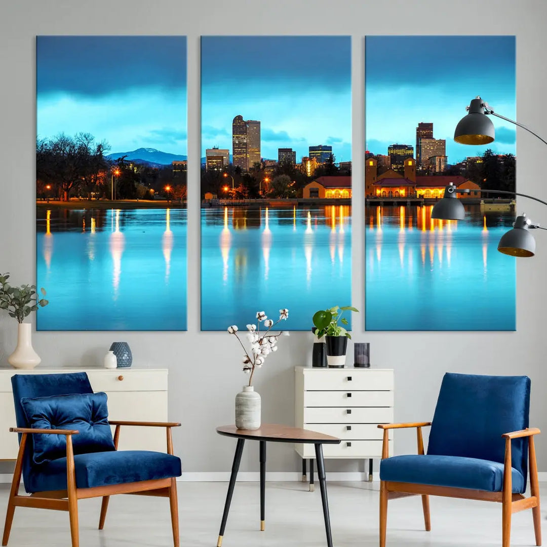 A living room in teal and brown decor showcases the "Denver City Lights Night Bright Turquoise Skyline Cityscape View" wall art canvas print above the couch. This large, museum-quality piece comes with a UV-protective coating.