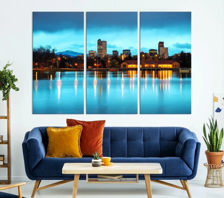 A living room in teal and brown decor showcases the "Denver City Lights Night Bright Turquoise Skyline Cityscape View" wall art canvas print above the couch. This large, museum-quality piece comes with a UV-protective coating.