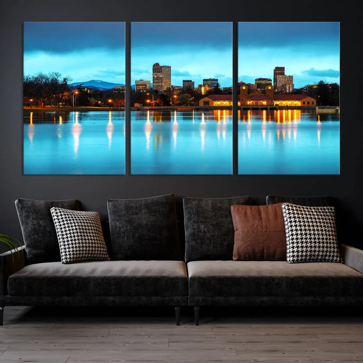 A living room in teal and brown decor showcases the "Denver City Lights Night Bright Turquoise Skyline Cityscape View" wall art canvas print above the couch. This large, museum-quality piece comes with a UV-protective coating.