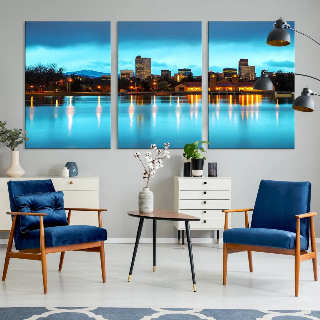 A living room in teal and brown decor showcases the "Denver City Lights Night Bright Turquoise Skyline Cityscape View" wall art canvas print above the couch. This large, museum-quality piece comes with a UV-protective coating.