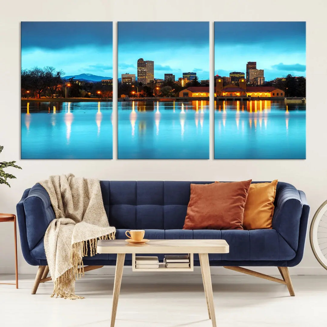 A living room in teal and brown decor showcases the "Denver City Lights Night Bright Turquoise Skyline Cityscape View" wall art canvas print above the couch. This large, museum-quality piece comes with a UV-protective coating.