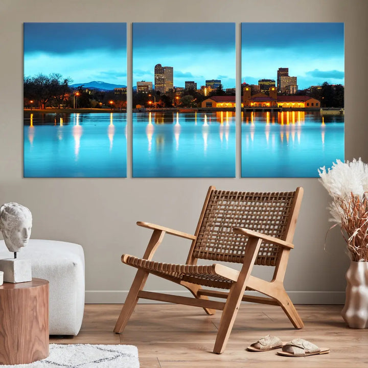 A living room in teal and brown decor showcases the "Denver City Lights Night Bright Turquoise Skyline Cityscape View" wall art canvas print above the couch. This large, museum-quality piece comes with a UV-protective coating.