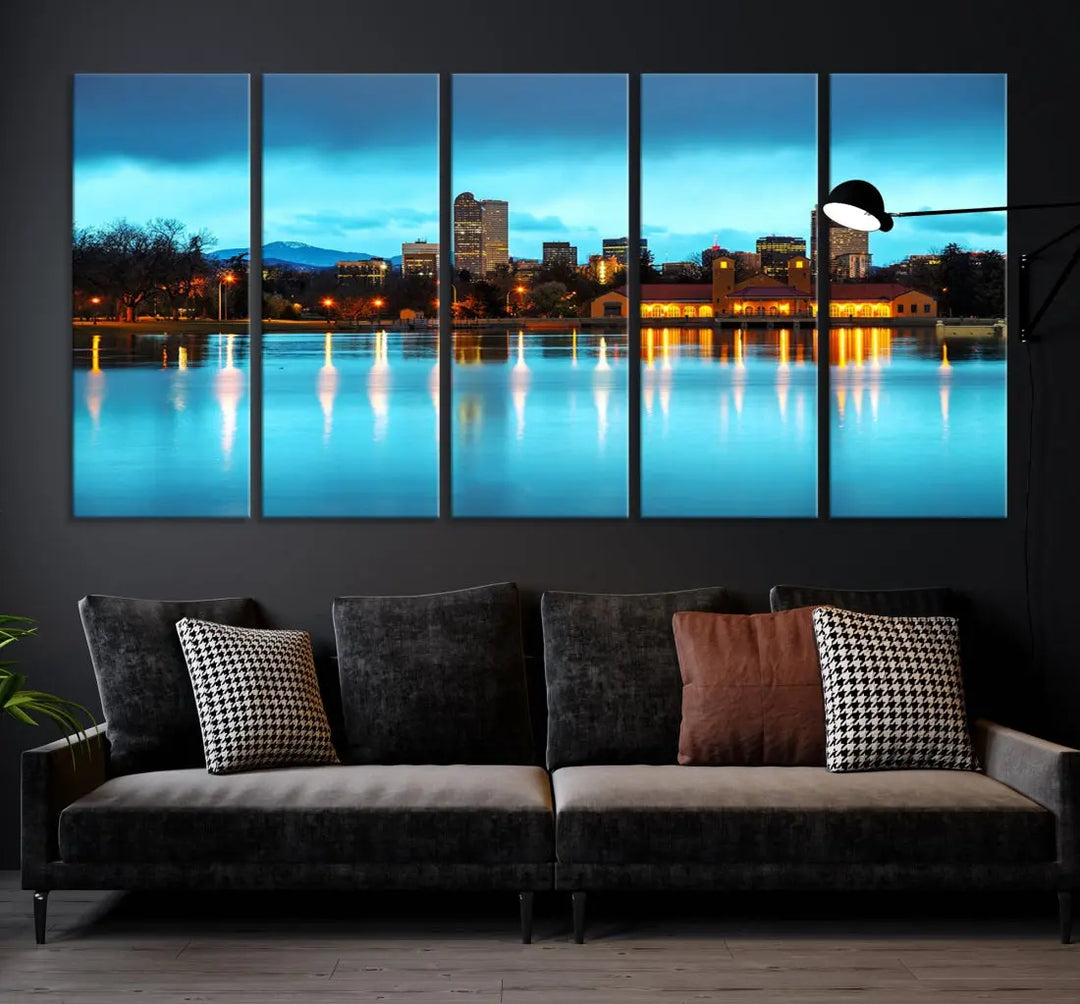 A living room in teal and brown decor showcases the "Denver City Lights Night Bright Turquoise Skyline Cityscape View" wall art canvas print above the couch. This large, museum-quality piece comes with a UV-protective coating.