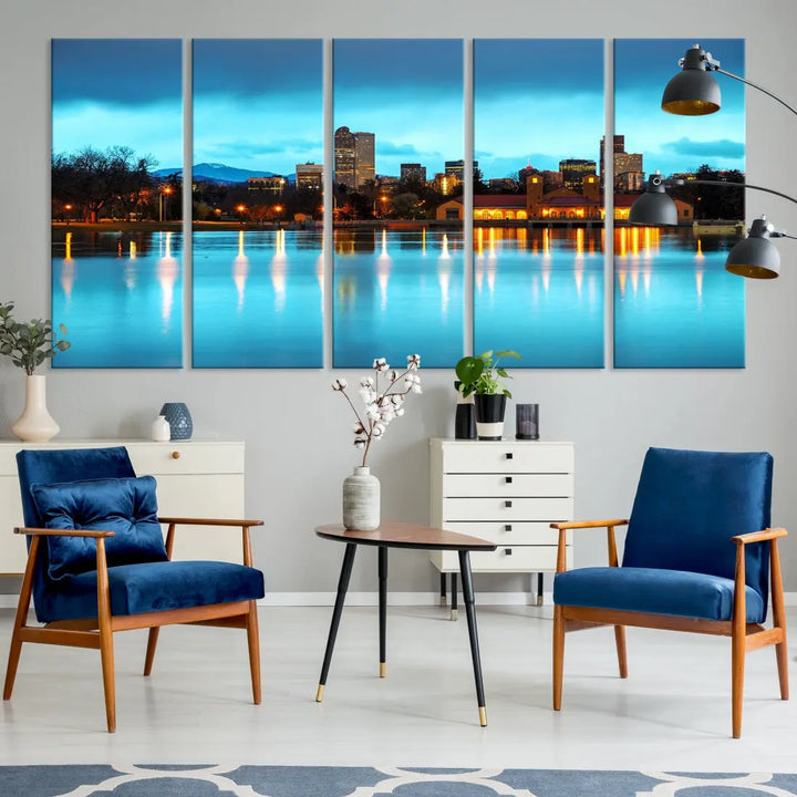 A living room in teal and brown decor showcases the "Denver City Lights Night Bright Turquoise Skyline Cityscape View" wall art canvas print above the couch. This large, museum-quality piece comes with a UV-protective coating.