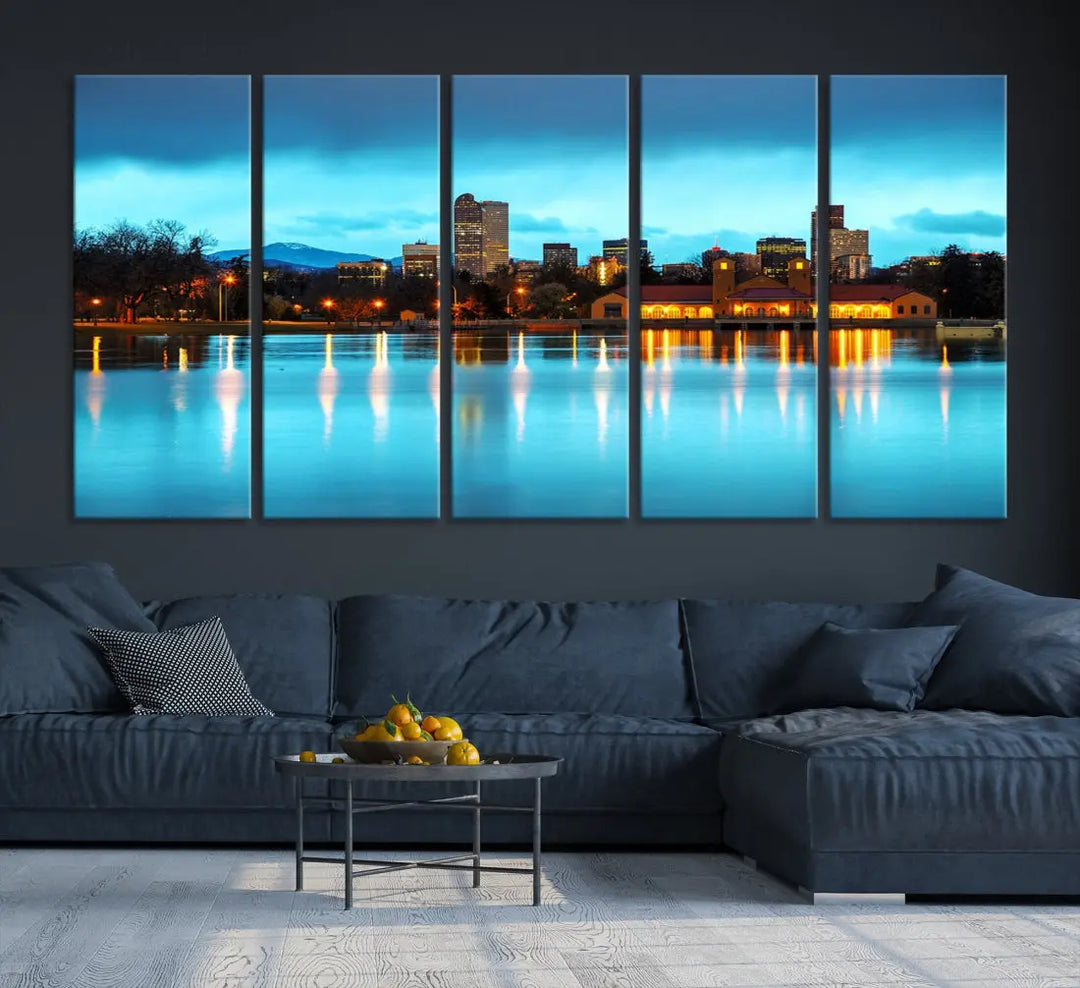 A living room in teal and brown decor showcases the "Denver City Lights Night Bright Turquoise Skyline Cityscape View" wall art canvas print above the couch. This large, museum-quality piece comes with a UV-protective coating.