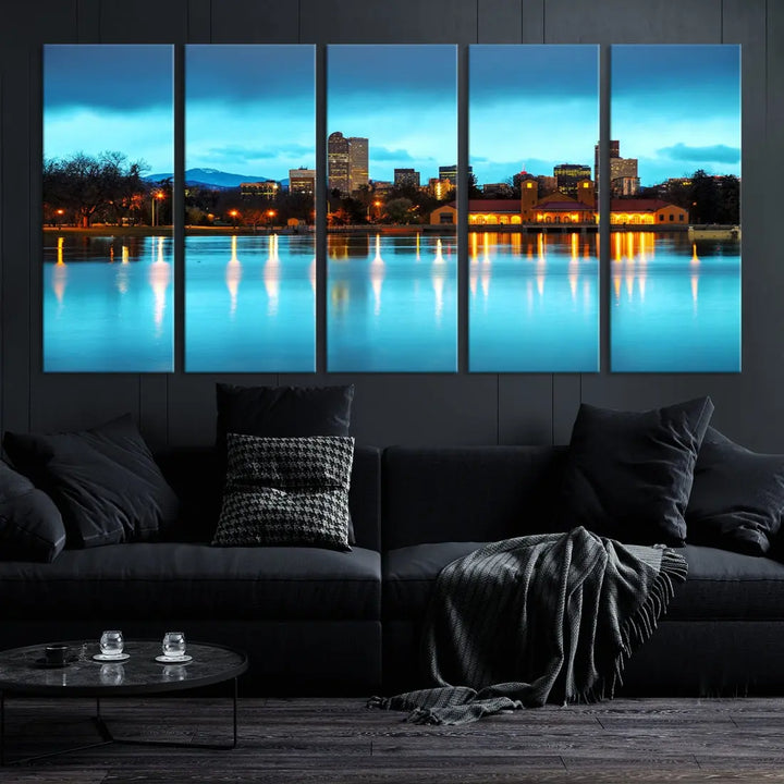 A living room in teal and brown decor showcases the "Denver City Lights Night Bright Turquoise Skyline Cityscape View" wall art canvas print above the couch. This large, museum-quality piece comes with a UV-protective coating.