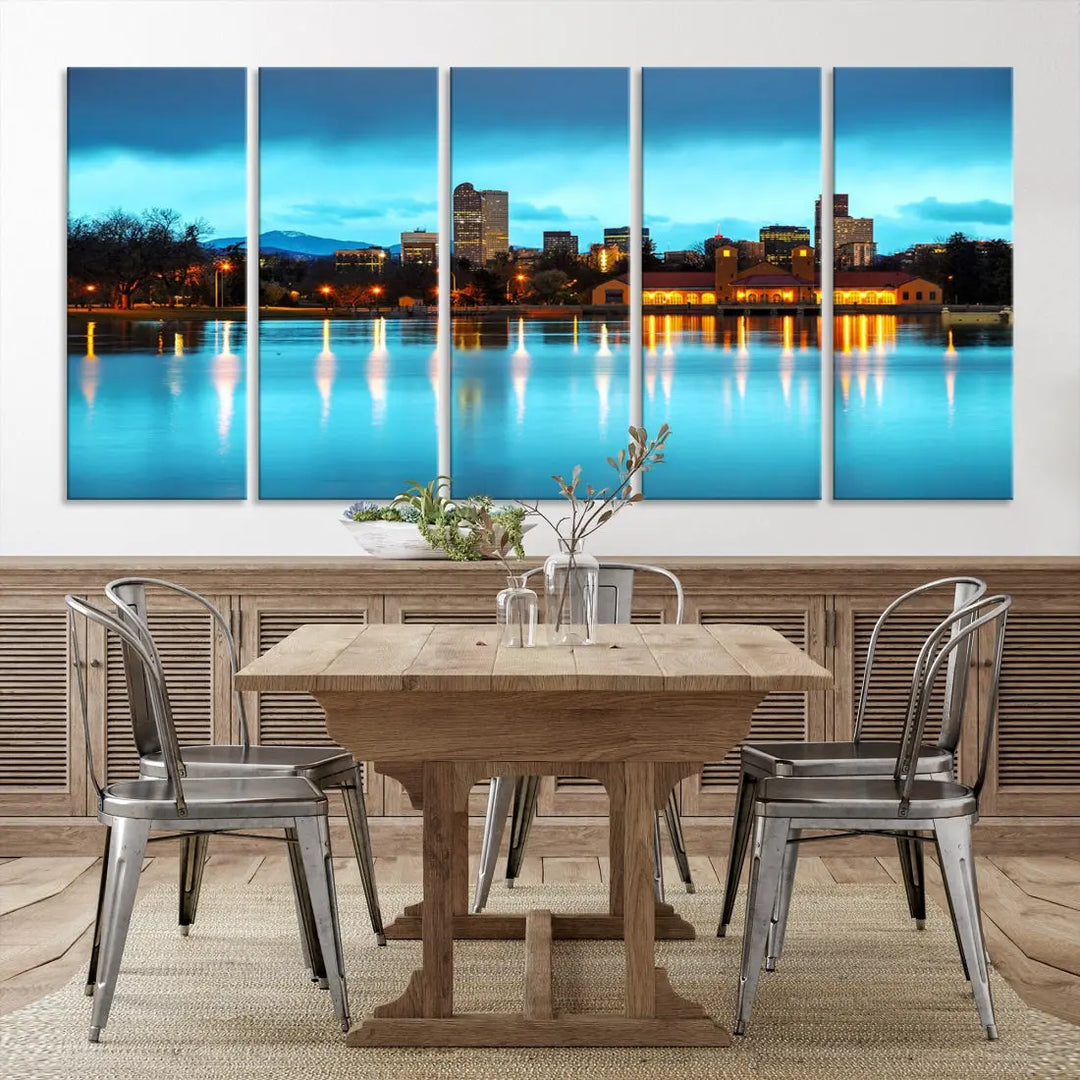 A living room in teal and brown decor showcases the "Denver City Lights Night Bright Turquoise Skyline Cityscape View" wall art canvas print above the couch. This large, museum-quality piece comes with a UV-protective coating.