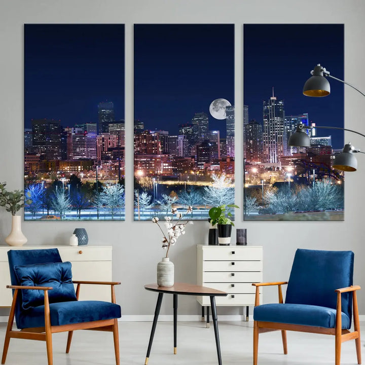 A cozy living room features the "Denver City Lights Night with Full Moon Skyline Cityscape View" wall art canvas print, gallery wrapped on museum-quality canvas.