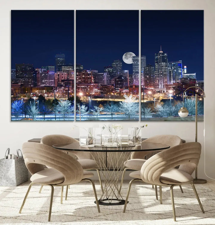 A cozy living room features the "Denver City Lights Night with Full Moon Skyline Cityscape View" wall art canvas print, gallery wrapped on museum-quality canvas.