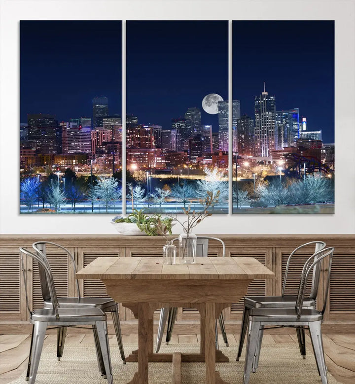 A cozy living room features the "Denver City Lights Night with Full Moon Skyline Cityscape View" wall art canvas print, gallery wrapped on museum-quality canvas.