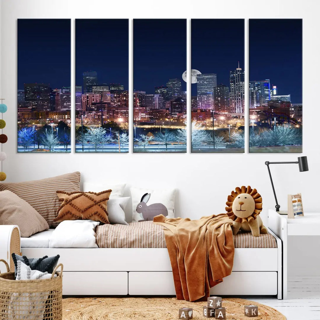 A cozy living room features the "Denver City Lights Night with Full Moon Skyline Cityscape View" wall art canvas print, gallery wrapped on museum-quality canvas.