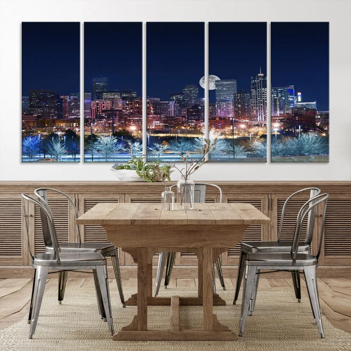 A cozy living room features the "Denver City Lights Night with Full Moon Skyline Cityscape View" wall art canvas print, gallery wrapped on museum-quality canvas.