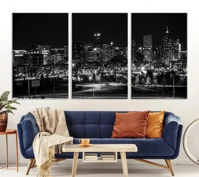 The Denver City Lights Skyline Black and White Wall Art Cityscape Canvas Print, a stunning three-panel piece, enhances the modern living room. Printed on museum-quality canvas and finished with a satin varnish, this artwork elegantly adds both charm and durability to the space.