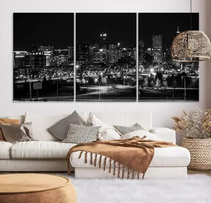 The Denver City Lights Skyline Black and White Wall Art Cityscape Canvas Print, a stunning three-panel piece, enhances the modern living room. Printed on museum-quality canvas and finished with a satin varnish, this artwork elegantly adds both charm and durability to the space.