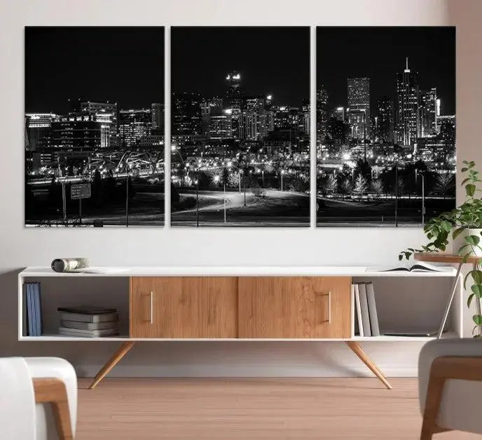 The Denver City Lights Skyline Black and White Wall Art Cityscape Canvas Print, a stunning three-panel piece, enhances the modern living room. Printed on museum-quality canvas and finished with a satin varnish, this artwork elegantly adds both charm and durability to the space.