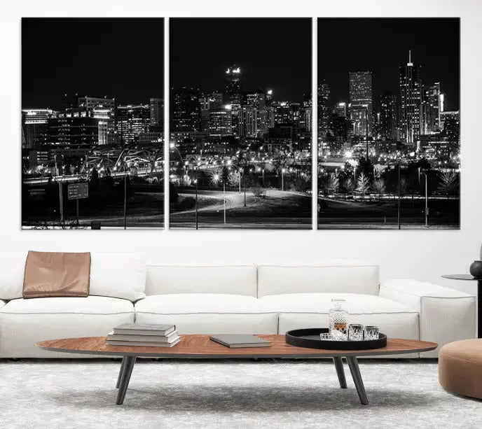 The Denver City Lights Skyline Black and White Wall Art Cityscape Canvas Print, a stunning three-panel piece, enhances the modern living room. Printed on museum-quality canvas and finished with a satin varnish, this artwork elegantly adds both charm and durability to the space.