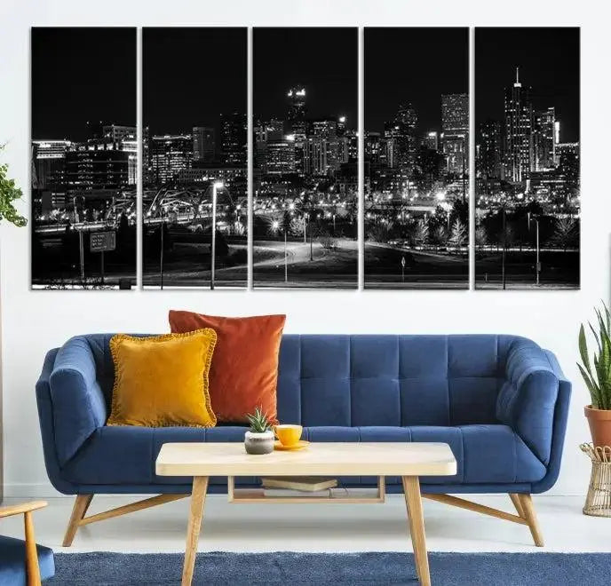 The Denver City Lights Skyline Black and White Wall Art Cityscape Canvas Print, a stunning three-panel piece, enhances the modern living room. Printed on museum-quality canvas and finished with a satin varnish, this artwork elegantly adds both charm and durability to the space.