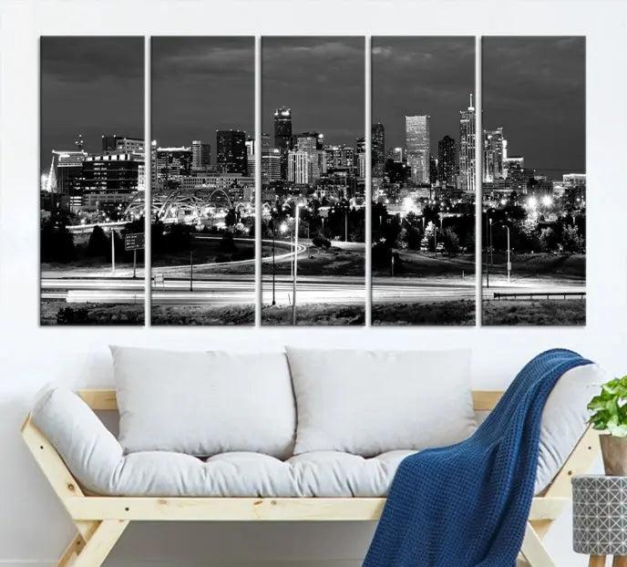 The "Denver City Lights Skyline Black and White Wall Art Cityscape Canvas Print" is elegantly displayed. This museum-quality canvas artwork, complete with a UV-protective coating, is ready to hang, adding both style and protection to your space.