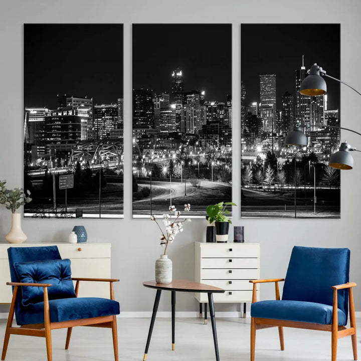 A modern living room featuring the Denver City Lights Skyline Black and White Cityscape Canvas Print above a sofa.