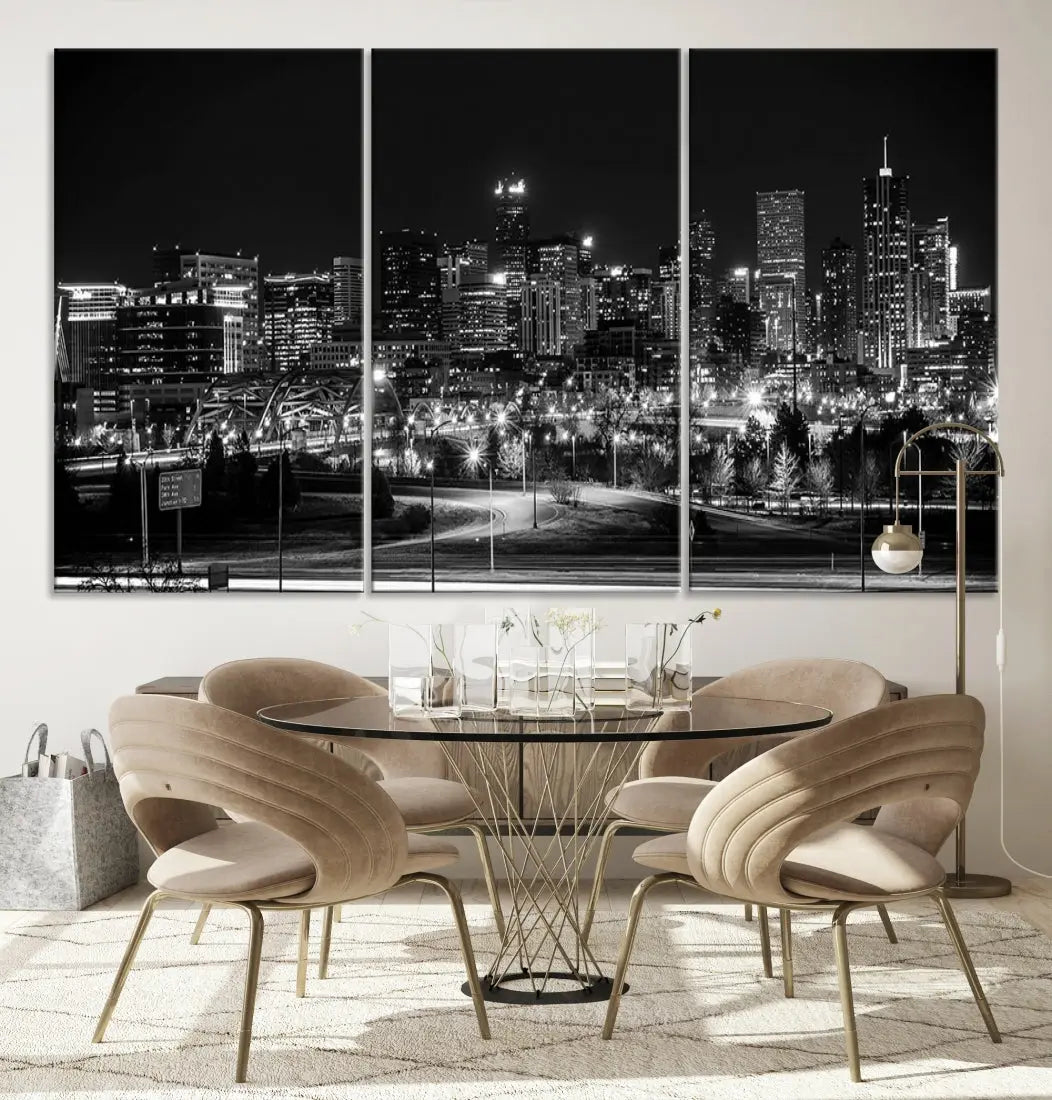 A modern living room featuring the Denver City Lights Skyline Black and White Cityscape Canvas Print above a sofa.