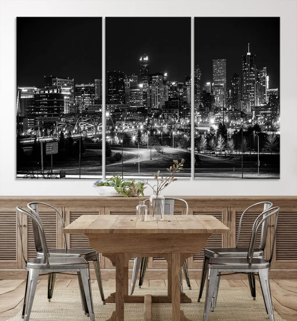 A modern living room featuring the Denver City Lights Skyline Black and White Cityscape Canvas Print above a sofa.