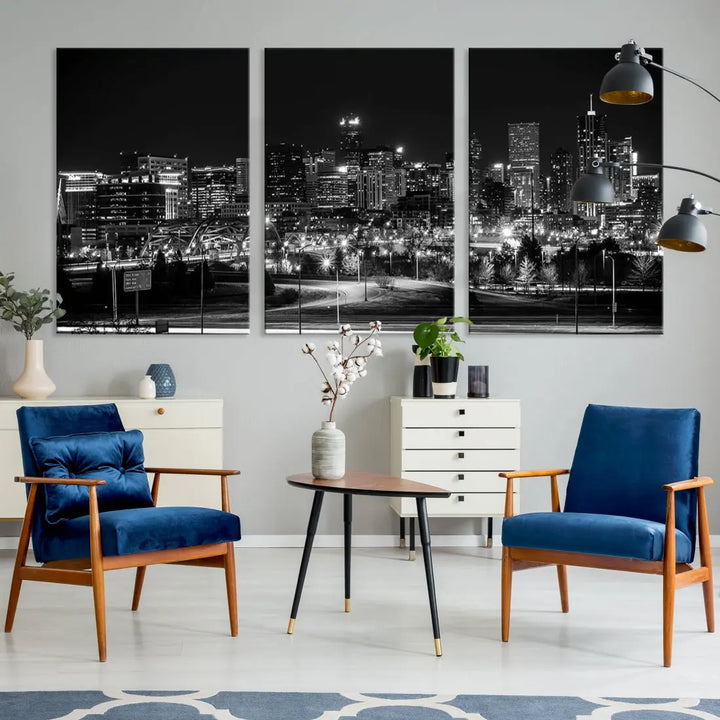 A modern living room featuring the Denver City Lights Skyline Black and White Cityscape Canvas Print above a sofa.