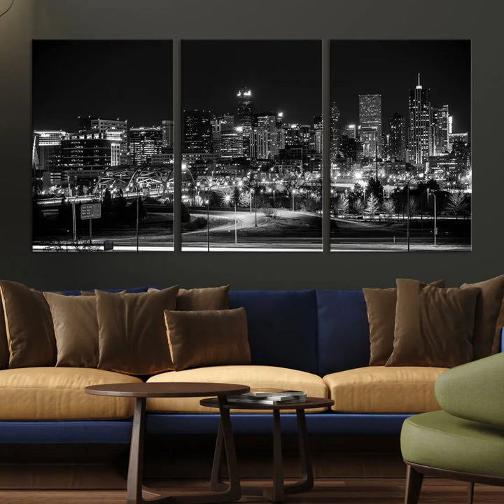 A modern living room featuring the Denver City Lights Skyline Black and White Cityscape Canvas Print above a sofa.