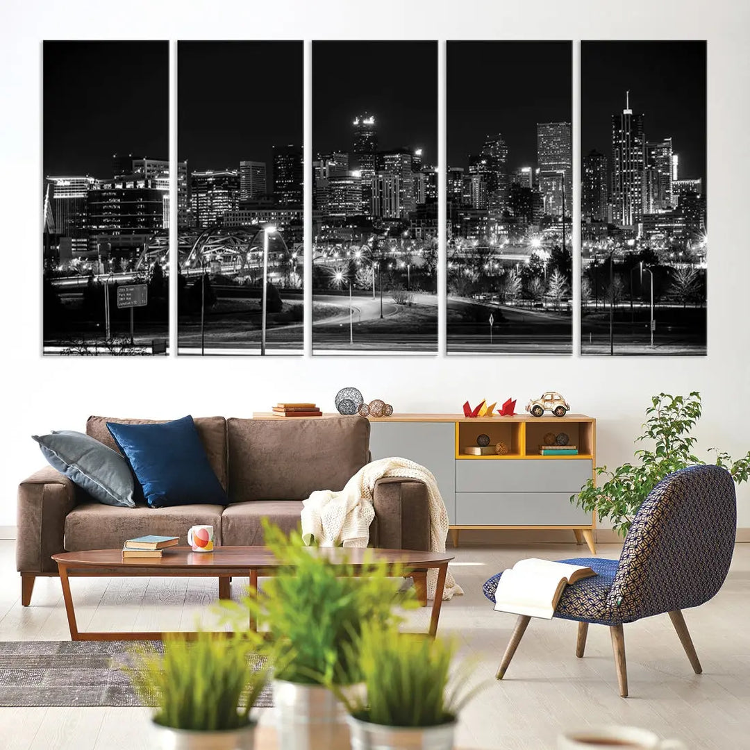 A modern living room featuring the Denver City Lights Skyline Black and White Cityscape Canvas Print above a sofa.