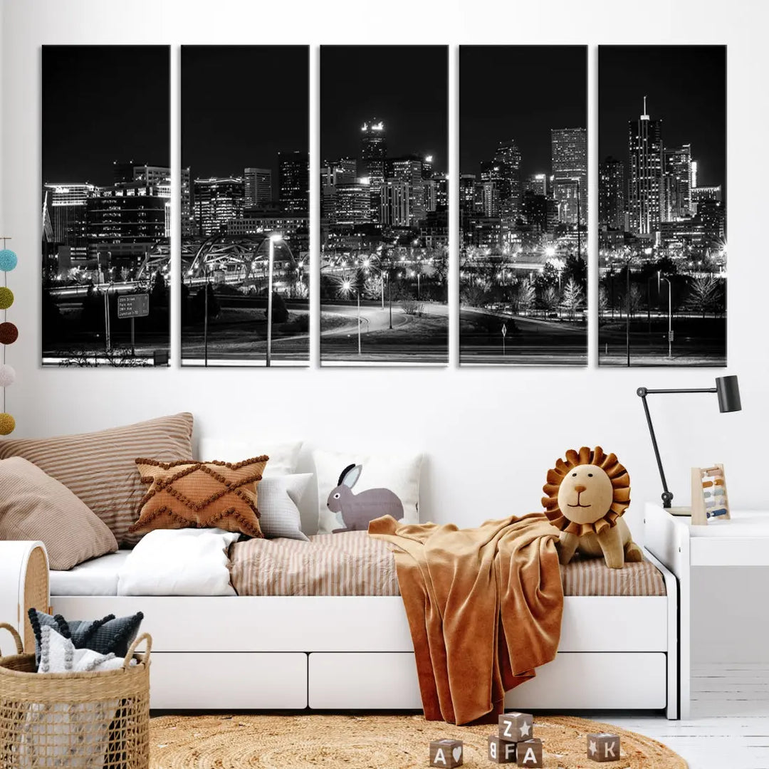 A modern living room featuring the Denver City Lights Skyline Black and White Cityscape Canvas Print above a sofa.