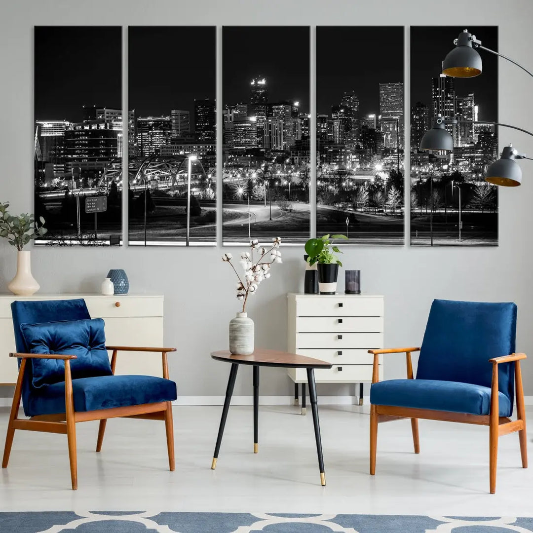 A modern living room featuring the Denver City Lights Skyline Black and White Cityscape Canvas Print above a sofa.