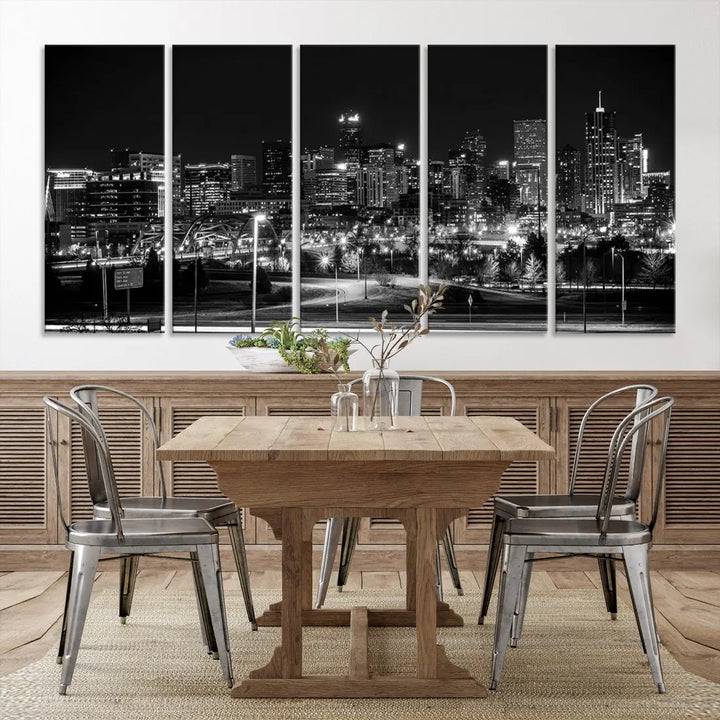 A modern living room featuring the Denver City Lights Skyline Black and White Cityscape Canvas Print above a sofa.