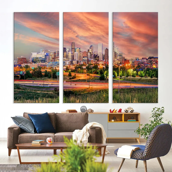 The modern living room showcases the "Denver City Lights Sunset Orange Cloudy Skyline Cityscape View Wall Art Canvas Print," a triptych of museum-quality canvases depicting a city skyline at sunset. This ready-to-hang artwork boasts a UV-protective coating to ensure lasting vibrancy.