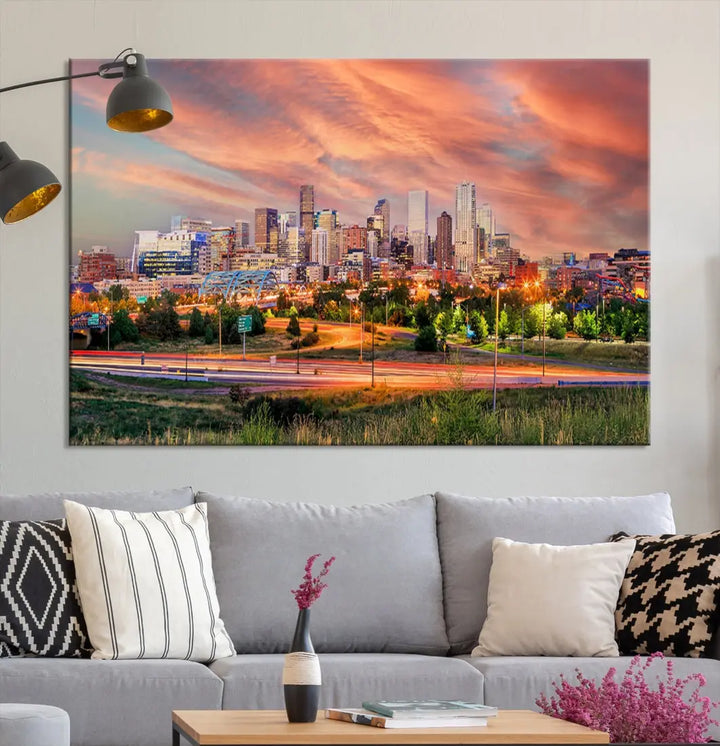 The modern living room showcases the "Denver City Lights Sunset Orange Cloudy Skyline Cityscape View Wall Art Canvas Print," a triptych of museum-quality canvases depicting a city skyline at sunset. This ready-to-hang artwork boasts a UV-protective coating to ensure lasting vibrancy.