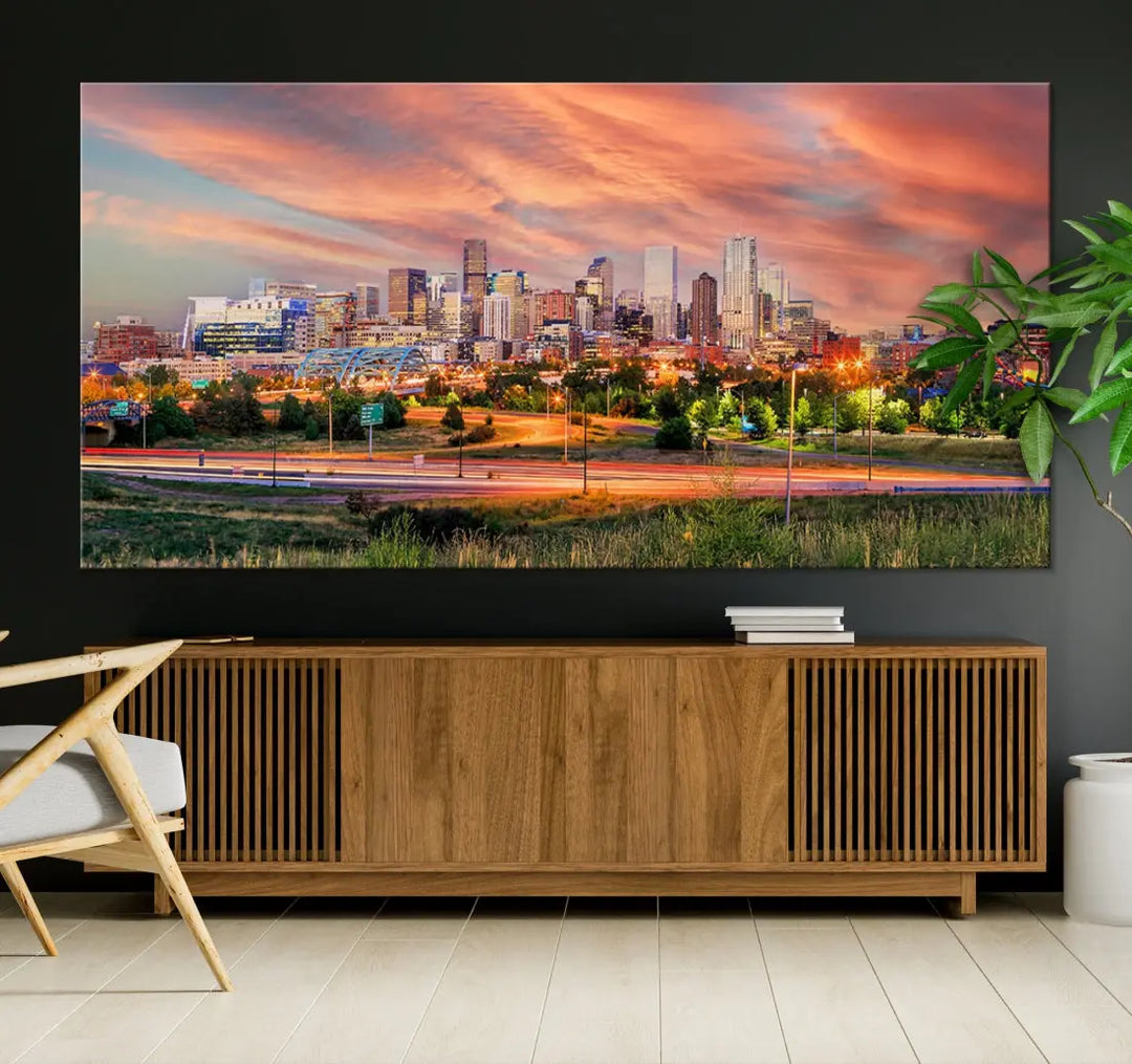 The modern living room showcases the "Denver City Lights Sunset Orange Cloudy Skyline Cityscape View Wall Art Canvas Print," a triptych of museum-quality canvases depicting a city skyline at sunset. This ready-to-hang artwork boasts a UV-protective coating to ensure lasting vibrancy.