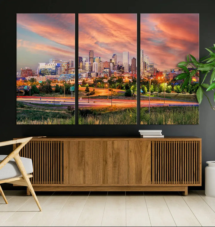 The modern living room showcases the "Denver City Lights Sunset Orange Cloudy Skyline Cityscape View Wall Art Canvas Print," a triptych of museum-quality canvases depicting a city skyline at sunset. This ready-to-hang artwork boasts a UV-protective coating to ensure lasting vibrancy.