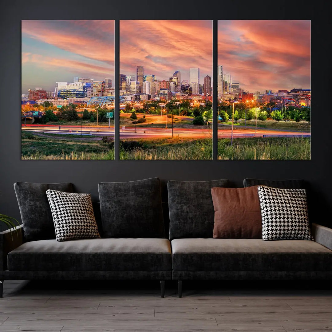 The modern living room showcases the "Denver City Lights Sunset Orange Cloudy Skyline Cityscape View Wall Art Canvas Print," a triptych of museum-quality canvases depicting a city skyline at sunset. This ready-to-hang artwork boasts a UV-protective coating to ensure lasting vibrancy.